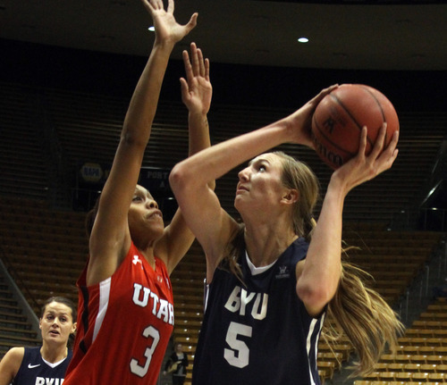 Rick Egan  | The Salt Lake Tribune 

Jennifer Hamson (5) BYU, looks for a shot, as Ashley Garfield (3) defends for the Lady Ute's, at the Marriottt Center in Provo, Saturday, December 10, 2011.