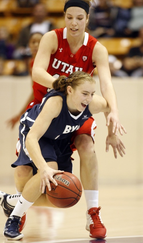 Rick Egan  | The Salt Lake Tribune 

BYU's  Haley Steed (33) is fouled by Utah's Michelle Plouffe, in basketball action, BYU vs. Utah, at the Marriott Center in Provo,   Saturday, December 10, 2011.