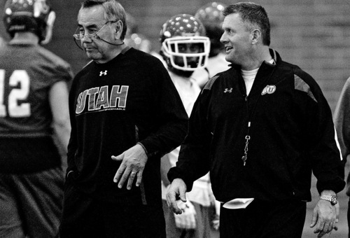 Utah offensive coordinator Norm Chow, left, talks with head coach Kyle Whittingham during an NCAA college football practice Thursday, Dec. 8, 2011, in Salt Lake City. Utah is scheduled to face Georgia Tech in the Sun Bowl on Dec. 31. (AP Photo/The Salt Lake Tribune, Chris Detrick)  DESERET NEWS OUT; LOCAL TV OUT; MAGS OUT