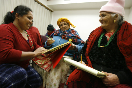 Francisco Kjolseth  |  The Salt Lake Tribune
English instructor Divya Acharya helps Bishnu Chapagai, center, and Radika Bhattarai with the basics as Bhutanese refugees attend a weekly English and citizenship class at an LDS wardhouse in Salt Lake City on Saturday. Doctors have identified a B12 vitamin deficiency in newly arriving Bhutanese refugees due to their poor diet in refugee camps over decades. The vitamin deficiency can lead to neurologic disorders. Now doctors are trying to encourage the newcomers to take vitamins and eat better. This is a nationwide issue.