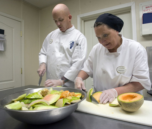Al Hartmann  |  The Salt Lake Tribune 
SL Valley Health department wants to promote sustainable restaurants. They like what executive chef William Jones, left, and sous chef Karen Merrill are doing.  They compost vegetable and fruit rinds from Coventry  Independent and Assisted Living in Cottonwood Heights.  At the end of the day Merrill takes home the scraps in buckets for her chickens and compost heap for the garden.