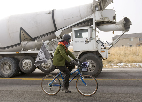 Al Hartmann  |  The Salt Lake Tribune
Members of OWS-Salt Lake staged a protest at the WalMart distribution center west of Granstville on Monday, Dec. 12, 2011. They slowly rode bikes in small groups along State Road 138 disrupting the flow of traffic in and out of the distribution center.