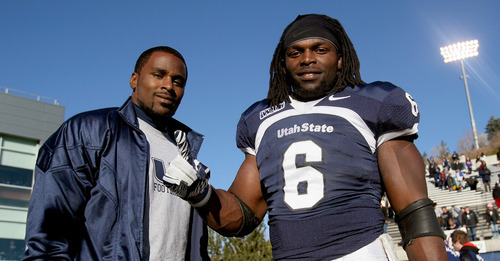 Chris Detrick  |  The Salt Lake Tribune

Former USU running back Emmitt White, left, and current running back Robert Turbin following the game against Nevada on November 26, 2011.