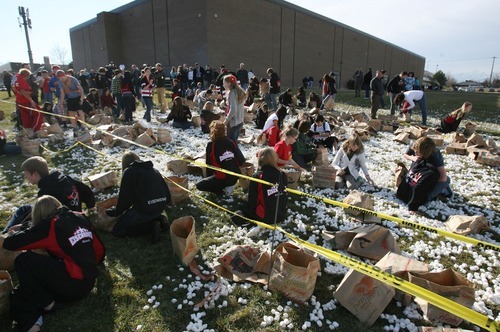 Steve Griffin  |  The Salt Lake Tribune

Hundreds of students at Eisenhower Junior High School tried to set a new world record for the World's Largest Marshmallow Fight by throwing or tossing nearly 2,000 pounds of 140,000 regular-sized marshmallows in about 15 minutes in Taylorsville, Utah Friday, December 2, 2011. Following the battle students cleaned up the whole mess.