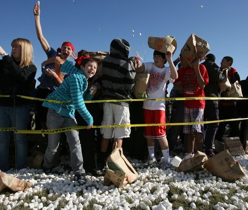 Steve Griffin  |  The Salt Lake Tribune
Hundreds of students at Eisenhower Junior High School attempted a new world record for the world's largest marshmallow fight by throwing 2,000 pounds of marshmallows -- about 140,000 of them -- in about 10 minutes in Taylorsville. Following the battle students cleaned up the whole mess.