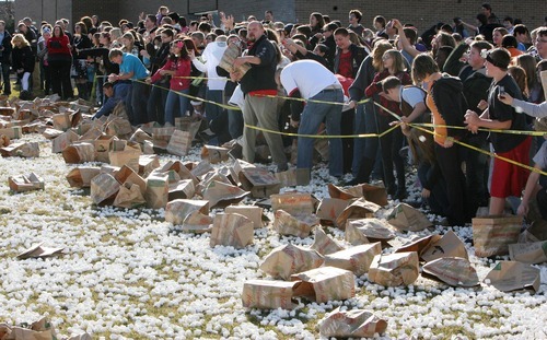 Steve Griffin  |  The Salt Lake Tribune
Hundreds of students at Eisenhower Junior High School attempted a new world record for the world's largest marshmallow fight by throwing 2,000 pounds of marshmallows -- about 140,000 of them -- in about 10 minutes in Taylorsville. Following the battle students cleaned up the whole mess.