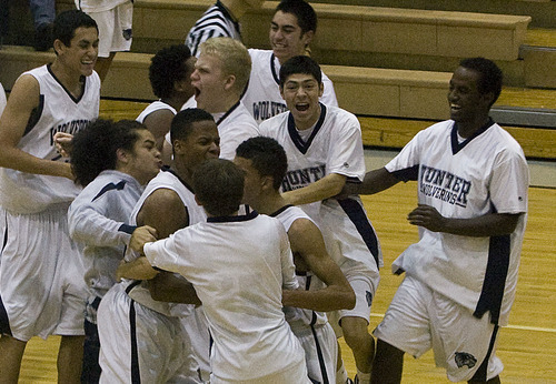 Scott Sommerdorf  |  The Salt Lake Tribune             
Hunter players celebrate Tre'Von Johnson's last second shot that dropped in for the improbable 61-59 comeback win over Herriman in West Valley City, Friday, December 9, 2011. Hunter was trailing by as many as 23 during the game, but came back in a torrid fourth quarter to win the game in front of the home crowd.
