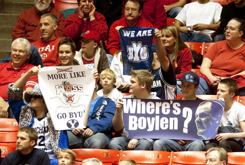 BYU fans hold up signs during an NCAA college basketball against Utah in Salt Lake City, Saturday, Dec. 10, 2011. (AP Photo/The Salt Lake Tribune, Trent Nelson)