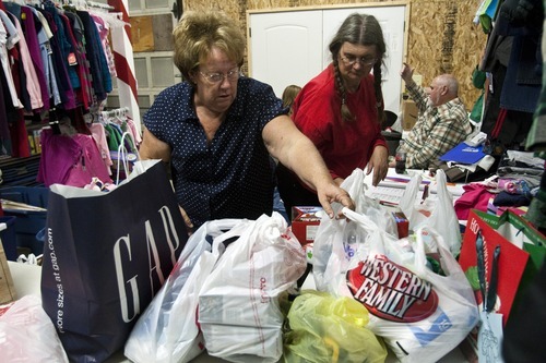 Chris Detrick  |  The Salt Lake Tribune
Volunteers Judy Jensen, left, and Cathy Adams help to sort donated clothes and toys Thursday for the 25th annual Sub for Santa program in Nephi. Sub for Santa is a Christmas assistance program for families in Juab County.