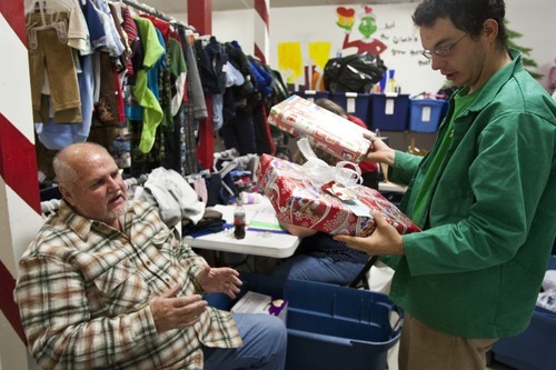 Chris Detrick  |  The Salt Lake Tribune
Founder George Morgan, left, and volunteer Robert F. Westfall help to sort donated clothes and toys Thursday for the 25th annual Sub for Santa program in Nephi. Sub for Santa is a Christmas assistance program for families in Juab County.