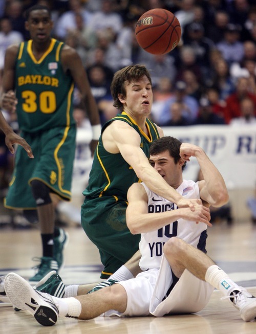 Steve Griffin  |  The Salt Lake Tribune

BYU's Matt Carlino fires the ball over his had as he battles Baylor's Brady Heslip during frist half action of the BYU Baylor basketball game  in Provo, Utah Saturday, December 17, 2011.