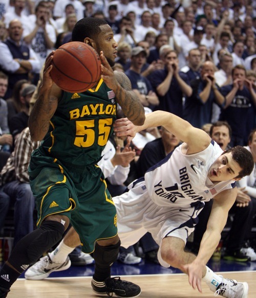 Steve Griffin  |  The Salt Lake Tribune

BYU's Matt Carlino slips down as he tries to trap Byalor's Pierre Jackson in the corner of the court during second half action of the BYU Baylor basketball game  in Provo, Utah Saturday, December 17, 2011.