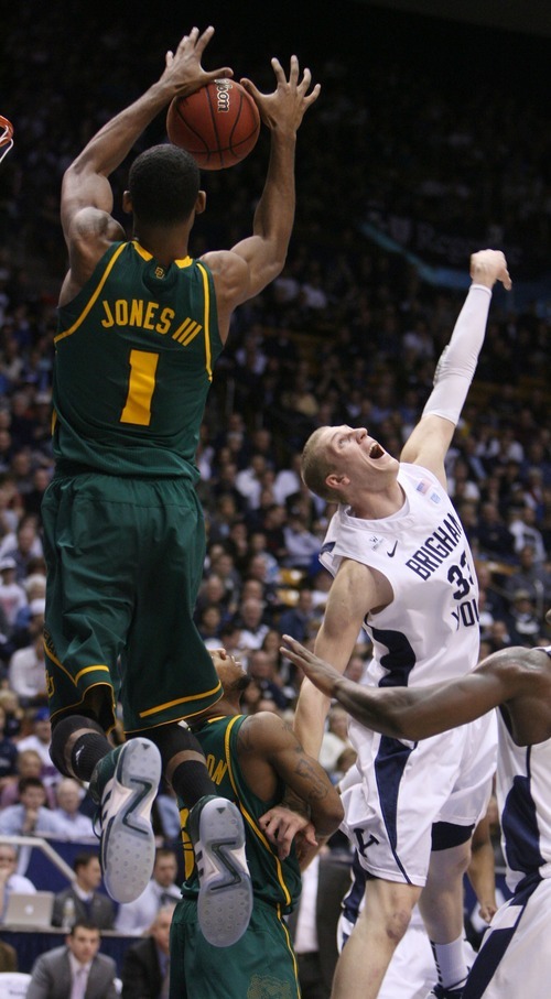 Steve Griffin  |  The Salt Lake Tribune

BYU's MAte Austin can't stop a lob pass as Byalor's Perry Jones III leaps towards the basket during frist half action of the BYU Baylor basketball game  in Provo, Utah Saturday, December 17, 2011.