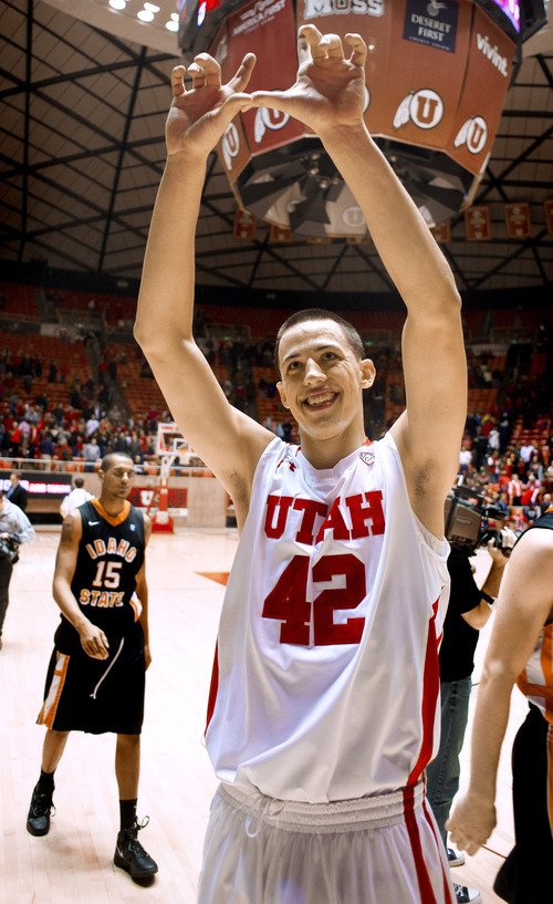 Utah Utes center Jason Washburn acknowledges fan cheers after beating the Idaho State Bengals on Friday, Dec. 16, 2011, in Salt Lake City, Utah. (© 2011 Douglas C. Pizac/Special to The Tribune)