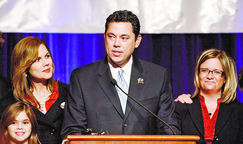 Newly elected congressman Jason Chaffetz is flanked by wife Julie and daughter Kate, 7, left, and campaign manager Jennifer Scott, right, as he addresses  supporters during election night celebrations at the Utah Republican Party headquarters at the Grand America Hotel in Salt Lake City on Tuesday,  November 4, 2008.  Steve Griffin/The Salt Lake Tribune