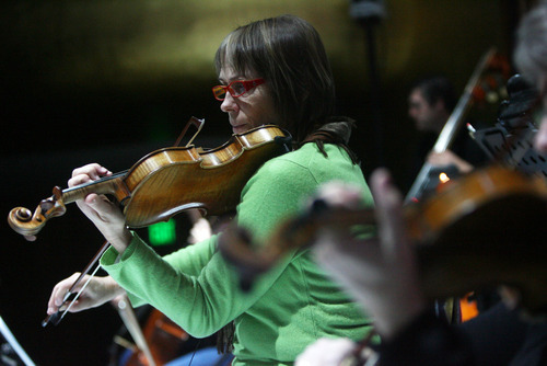 Kim Raff | The Salt Lake Tribune
Freelance violinst Meredith Campbell rehearses for Kurt Bestor's Christmas concert at Abravanel Hall in Salt Lake City on Thursday, Dec. 8, 2011.