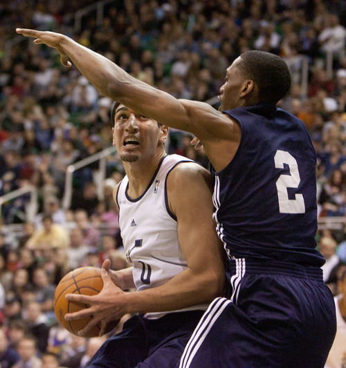 Jeremy Harmon  |  The Salt Lake Tribune

Utah's Enes Kanter is defended by teammate Paul Carter as the Utah Jazz scrimmage at EnergySolutions Arena in Salt Lake City, Saturday, Dec. 17, 2011.