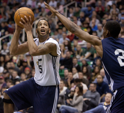 Jeremy Harmon  |  The Salt Lake Tribune

Utah's Devin Harris shoots past teammate Paul Carter as the Utah Jazz scrimmage at EnergySolutions Arena in Salt Lake City, Saturday, Dec. 17, 2011.