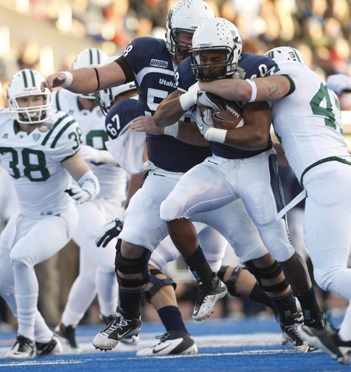 Chris Detrick  |  The Salt Lake Tribune
Utah State Aggies running back Michael Smith (20) is tackled by Ohio Bobcats linebacker Noah Keller (47) during the first half of the Famous Idaho Potato Bowl at Bronco Stadium Saturday December 17, 2011. Utah State is winning the game 9-7.