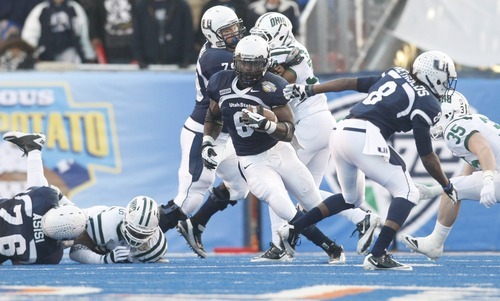 Chris Detrick  |  The Salt Lake Tribune
Utah State Aggies running back Robert Turbin (6) runs past Ohio Bobcats safety Nathan Carpenter (35) during the first half of the Famous Idaho Potato Bowl at Bronco Stadium Saturday December 17, 2011. Utah State is winning the game 9-7.