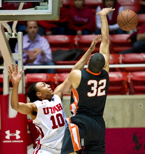 Utah Utes forward Dijon Farr (10) rejects the shot attempt by Idaho State Bengals forward Abner Moreira (32) during the first half Friday, Dec. 16, 2011, in Salt Lake City, Utah. (© 2011 Douglas C. Pizac/Special to The Tribune)