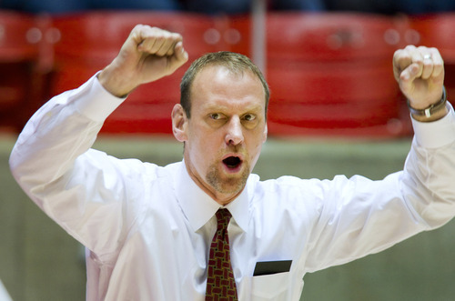 Utah Utes head coach Larry Krystkowiak signals his players against the Idaho State Bengals during the first half Friday, Dec. 16, 2011, in Salt Lake City, Utah. (© 2011 Douglas C. Pizac/Special to The Tribune)