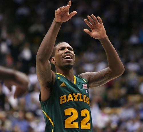 Steve Griffin  |  The Salt Lake Tribune

With seconds remaining in the game Baylor's A.J. Walton grimaces after missing the front end of a one-and-one during second half action of the BYU Baylor basketball game  in Provo, Utah Saturday, December 17, 2011.