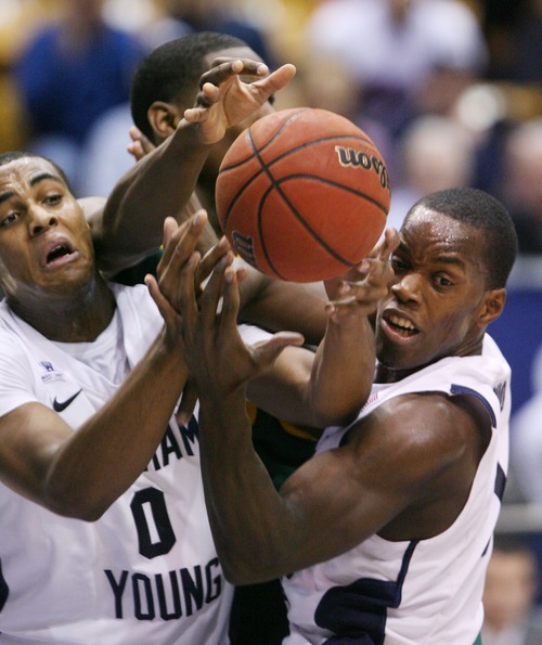 Steve Griffin  |  The Salt Lake Tribune

BYU's Brandon Davies and Charles Abouo battle Baylor's Quincy Miller for a rebound during frist half action of the BYU Baylor basketball game  in Provo, Utah Saturday, December 17, 2011.