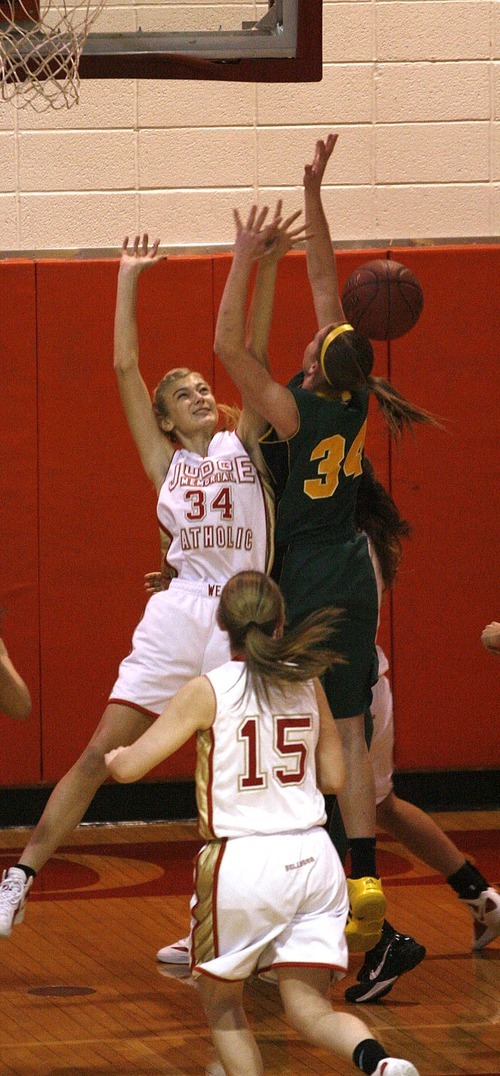 Paul Fraughton | The Salt Lake Tribune
Kearns' Micaelee Orton is fouled by Judge High's Julia Wheatly. Kearns High School girls team played Judge Memorial girls at Judge.
  Monday, December 19, 2011