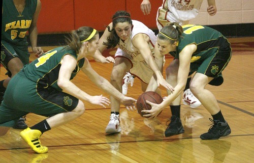 Paul Fraughton | The Salt Lake Tribune
Kearns' Micaelee Orton, left  and Haily Ross, right  fight Judge High's  Kailie Quinn for the ball. and Kearns High School girls team played Judge Memorial girls at Judge.
  Monday, December 19, 2011