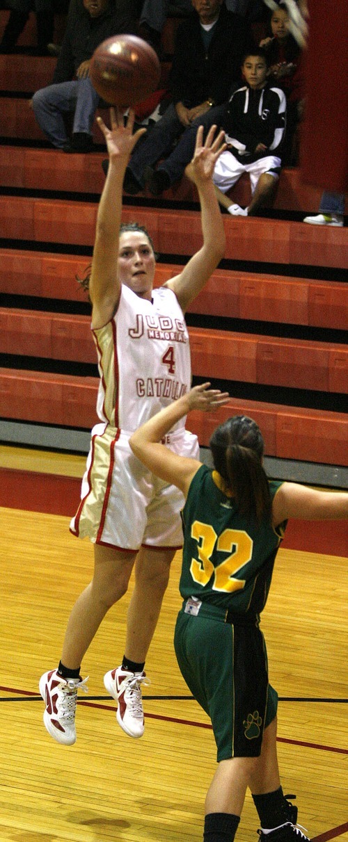 Paul Fraughton | The Salt Lake Tribune
Judge High's Kailie Quinn shoots the ball over  Kearns High's C'era Valdez. Kearns High School girls team played Judge Memorial girls at Judge.
  Monday, December 19, 2011