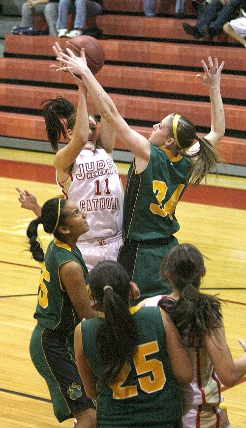 Paul Fraughton | The Salt Lake Tribune
Judge High's Donna Sansone is fouled as she shoots by Kearns' Micaelee Orton. Kearns High School girls team played Judge Memorial girls at Judge.
  Monday, December 19, 2011