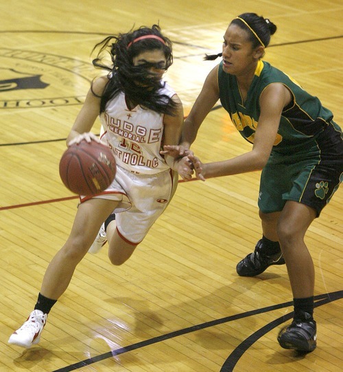 Paul Fraughton | The Salt Lake Tribune
 With her hair flying Judge High's Sarah Nakamura drives past Kearns High's Tavane Afatasi to the basket Kearns High School girls team played Judge Memorial girls at Judge.
  Monday, December 19, 2011