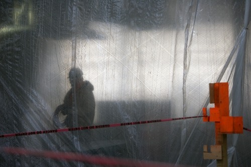 Kim Raff | The Salt Lake Tribune
Construction worker is seen through plastic hanging in the outdoors store, Scheels, in Sandy, Utah on Wednesday. The store uses 4 million pounds of structural steel and the store is expected to open in Oct. 6, 2012.