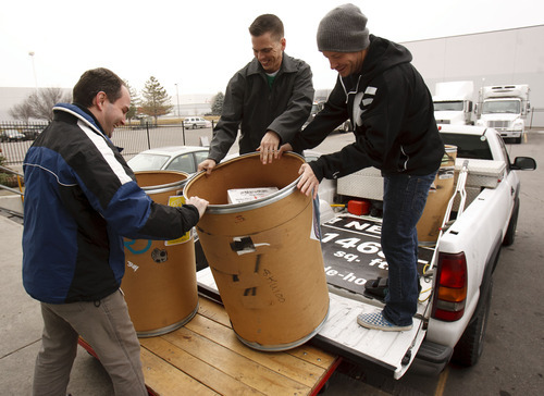 Trent Nelson  |  The Salt Lake Tribune
Brandon Daniels, left, a food drive specialist  with the Utah Food Bank, helps Griffin Kearns and Nate Ure unload donations. Skate4Homies and YuR Designs of Murray pulled together more than 100 skateboarders to collect food. The two organizations dropped off the donations this week at the Utah Food Bank in Salt Lake City.