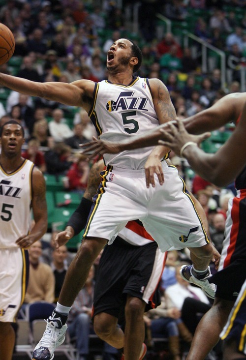 Steve Griffin  |  The Salt Lake Tribune

Utah Jazz guard Devin Harris scoops the ball up for two during first half action of the Utah Jazz versus Portland Trail Blazers game at EnergySolutions Arena in Salt Lake City, Utah Wednesday, December 21, 2011.