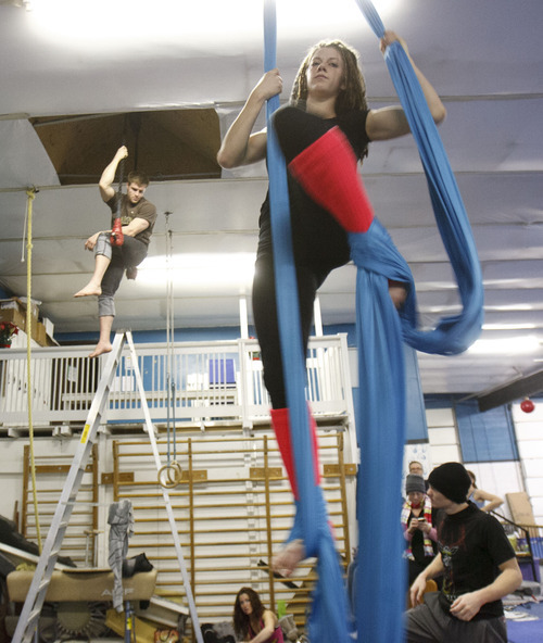 Trent Nelson  |  The Salt Lake Tribune
Tyce Nielsen performs on the trapeze, with Charlee Shae on the 