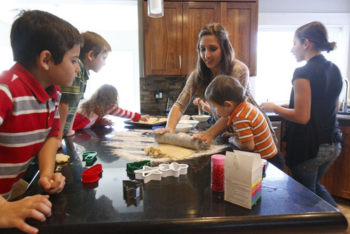 Trent Nelson  |  The Salt Lake Tribune
Becky Rasmussen, center, received a Kimberly-Clark $15,000 MomInspired Grant that will help her market her 