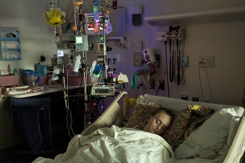 Chris Detrick  |  The Salt Lake Tribune
Megan Birk sleeps at Primary Children's Hospital Wednesday December 7, 2011. Megan Birk, 18, has survived innumerable impossible medical hurdles. From being born severely premature to leukemia to a heart transplant to a recent bout with tumors. Her mother considers her an angel, filled with good, determined to survive.