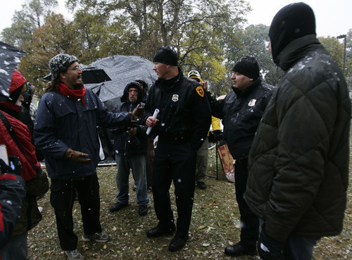 Kim Raff  | The Salt Lake Tribune
Salt Lake Police Chief Chris Burbank talks with Daniel McGuire after a Q & A with the protesters at Occupy Salt Lake at Pioneer Park on Saturday, November 12, 2011.