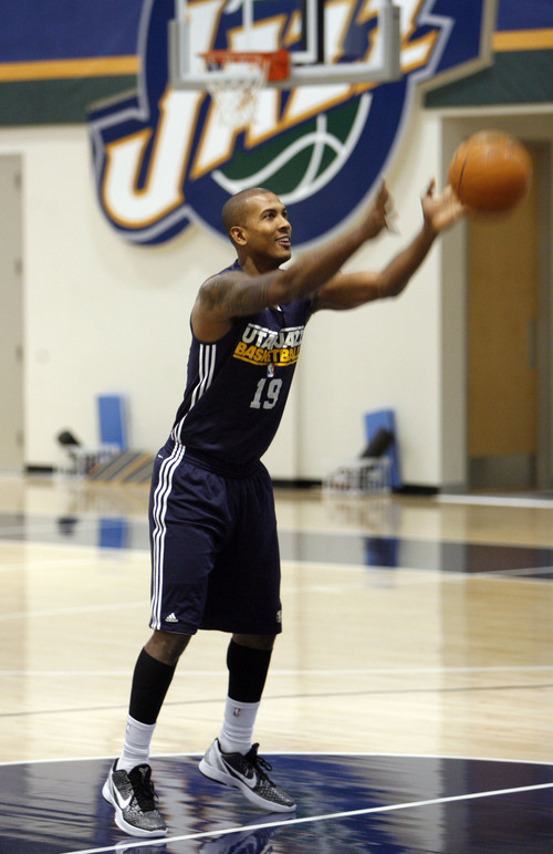 Francisco Kjolseth  |  The Salt Lake Tribune
Utah Jazz player Raja Bell tosses the ball under hand as he sets the rules for Jeremy Evans to follow while playing around before the start of basketball practice on Saturday, December 24, 2011, at the Jazz practice facility in Salt Lake City.