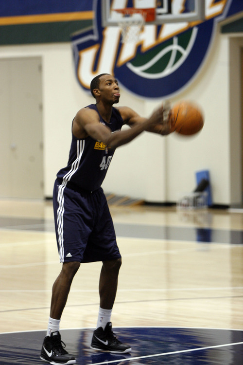 Francisco Kjolseth  |  The Salt Lake Tribune
Utah Jazz player Jeremy Evans tosses the ball under hand as he tries to keep up with Raja Bell while playing around before the start of basketball practice on Saturday, December 24, 2011, at the Jazz practice facility in Salt Lake City.