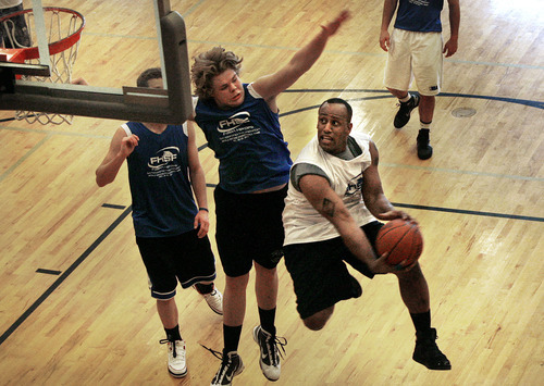 Scott Sommerdorf  |  The Salt Lake Tribune             
Danny Grant drives to the hoop for a shot against the Blue team at Clearfield Aquatic Center during the attempt to establish a world record for the longest basketball game played. Beginning with a Monday 9 a.m. tipoff, the game is planned to run through Friday with no timeouts, halftime or other breaks. The Fallen Heroes Scholarship Foundation is trying to use the event as a fundraiser.