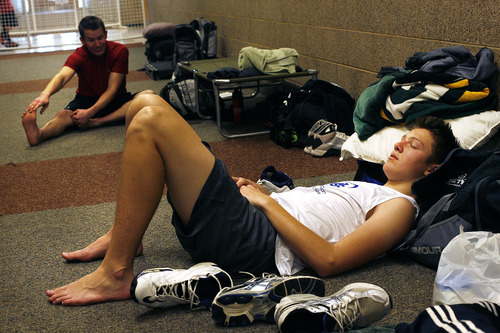 Scott Sommerdorf  |  The Salt Lake Tribune             
Bruce Christy of Draper, takes a snooze in the hallway outside the basketball court at Clearfield Aquatic Center during the attempt to establish a world record for the longest basketball game played. The game is expected to run through Friday.