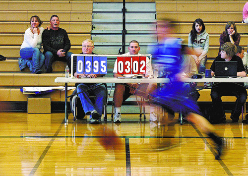 Scott Sommerdorf  |  The Salt Lake Tribune             
Kurt Spencer (in white shirt), mans the scoreboard at Clearfield Aquatic Center during the attempt to establish a world record for the longest basketball game played, Monday, December 26, 2011. The game was a little over three hours old at this point and the blue team was way ahead of the white team as The Fallen Heroes Scholarship Foundation is attempting a world record for longest played continuous basketball game, as a fundraiser. The game started at 9 a.m. Monday, and is planned to run through Friday.
