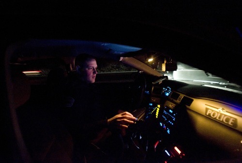 Kim Raff | The Salt Lake Tribune
Layton uses money from the state beer tax to to fund officer Nick Nalder whose primary job is to patrol for DUIs. DUI traffic officer Nick Nalder checks of warrents on a pulled over vehicle during a traffic violation stop while patrolling for DUIs in Layton on Wednesday, Dec. 21, 2011.