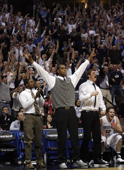 Trent Nelson  |  The Salt Lake Tribune
BYU's Brandon Davies and Chris Collinsworth cheer from the bench as BYU defeats Gonzaga in the NCAA Tournament in Denver on Saturday, March 19, 2011, earning a trip to the Sweet 16.