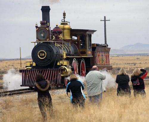 Al Hartmann  |  The Salt Lake Tribune
Photographers gather for a picture of Union Pacific steam locomotive 199 as it rolls down the track to the Golden Spike National Historic Site visitor center in northwestern Utah on Wednesday, Dec. 28, 2011. Golden Spike holds its annual Winter Steam Festival on December 28-30 Folks can get up close to tour the locomotive cab, see steam demonstrations as well as take a ride on a muscle-powered handcart.