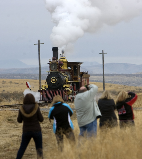 Al Hartmann  |  The Salt Lake Tribune
Photographers gather for a picture of Union Pacific steam locomotive 199 as it rolls down the track to the Golden Spike National Historic Site visitor center in northwestern Utah on Wednesday. Golden Spike holds its annual Winter Steam Festival on December 28-30 Folks can get up close to tour the locomotive cab, see steam demonstrations as well as take a ride on a muscle powered handcart.