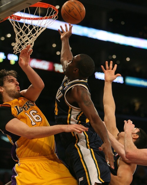Steve Griffin  |  The Salt Lake Tribune

Utah's Paul Millsap crashes into Pau Gasol as he drives to the basket during first half action in the Jazz Lakers game at the Staples Center in  in Los Angeles, CA Tuesday, December 27, 2011.